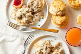 plates of vegetarian biscuits with gravy and blood orange slices