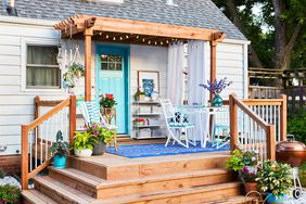 wooden front porch with blue seating area